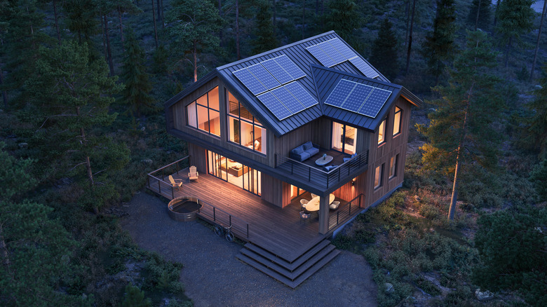 Lit home with solar panels 