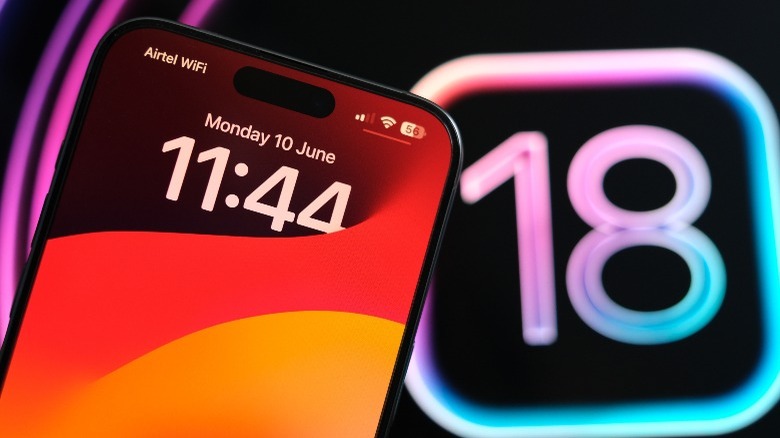 iPhone with iOS 18 logo