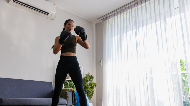 woman boxing at home