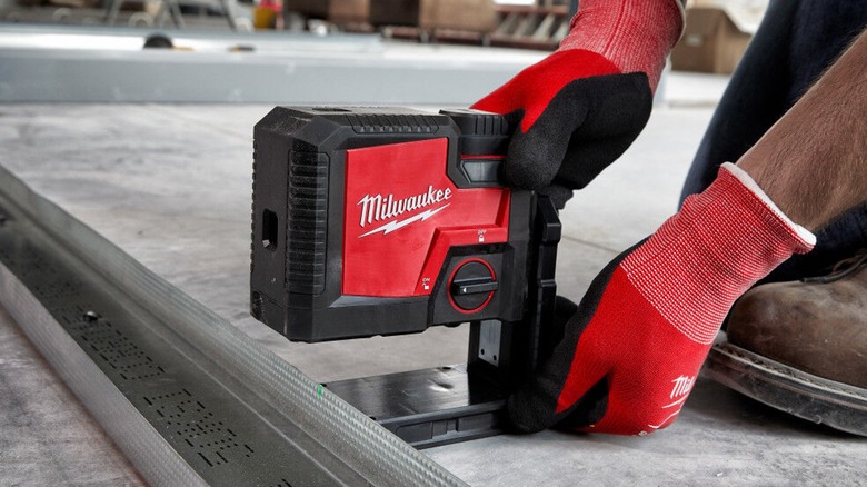 Rechargeable Milwaukee laser level in use