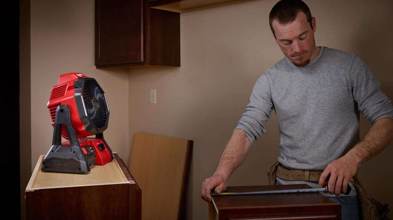 installing cabinets with help from M18 fan