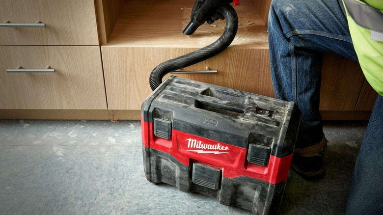 contractor using M18 shop vac