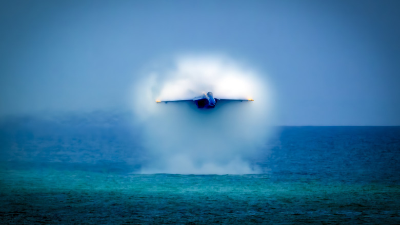 a Blue Angels jet breaks sound barrier right over the water