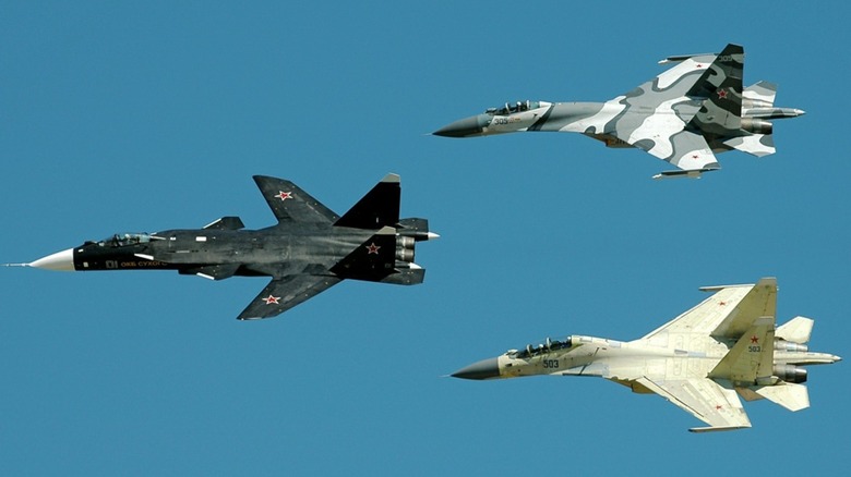 Sukhoi Su-47 and two Su-27s with different wing designs