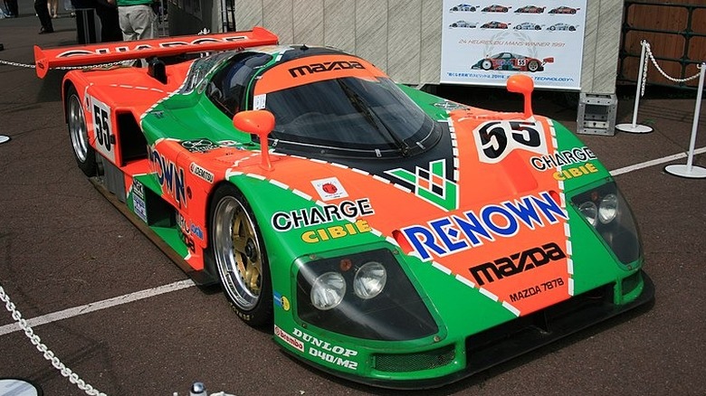 Orange and green Mazda 787b race car