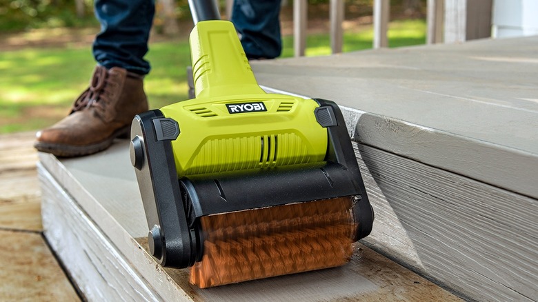 A Ryobi scubber cleaning the floor