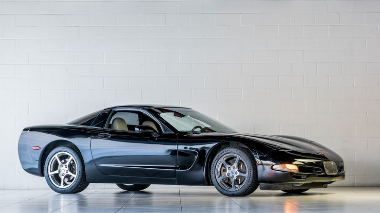 A black Chevrolet Corvette C5 liftback, front 3/4 view