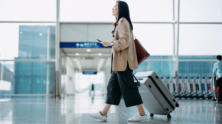 Woman with a trolley briefcase