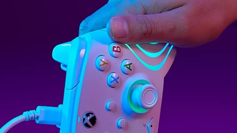 a hand holding an Afterglow Wave Controller