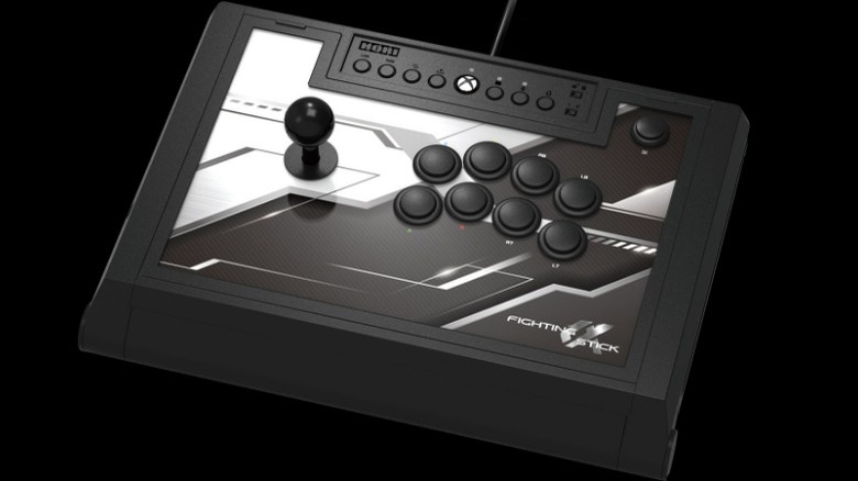 A black and white Hori Fighting Stick α.