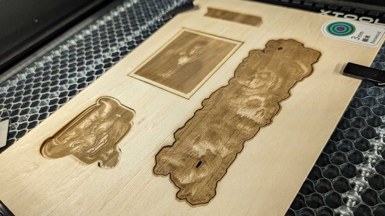 Engraved designs on laser cut wood