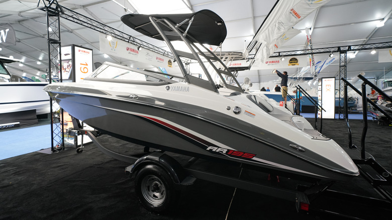 A Yamaha AR195 on a trailer inside an exhibit at a boat show