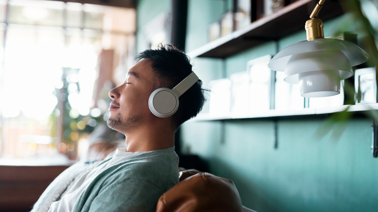 man relaxing with headphones