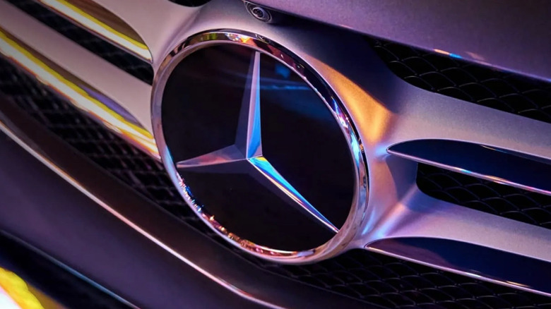 A Mercedes-Benz logo in the front grille of a vehicle.