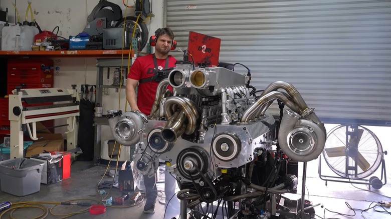 Starting the 12-rotor Wankel in his shop, Rob Dahm standing behind the engine, grinning