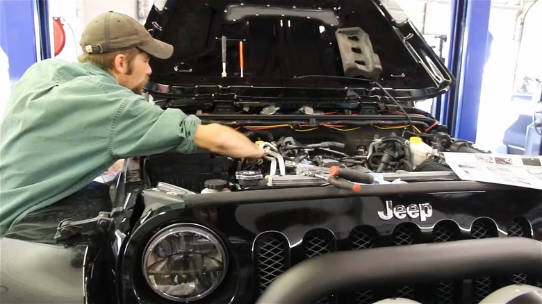 RubiTrux mechanic working on Jeep