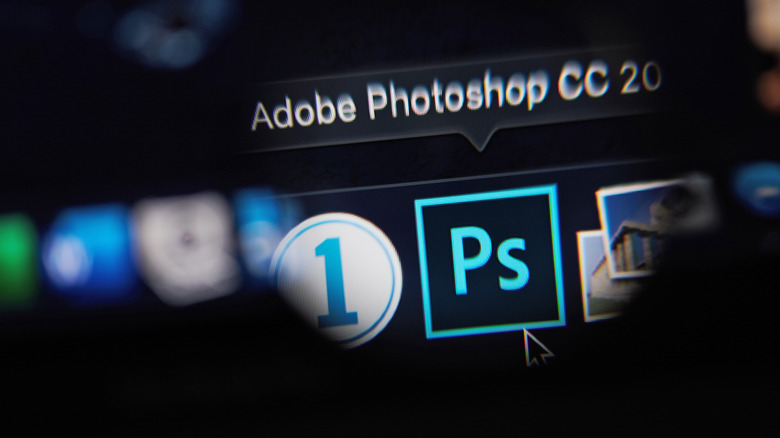 Adobe Photoshop logo on a computer.