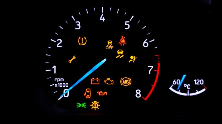 An image of various automotive dashboard warning lights