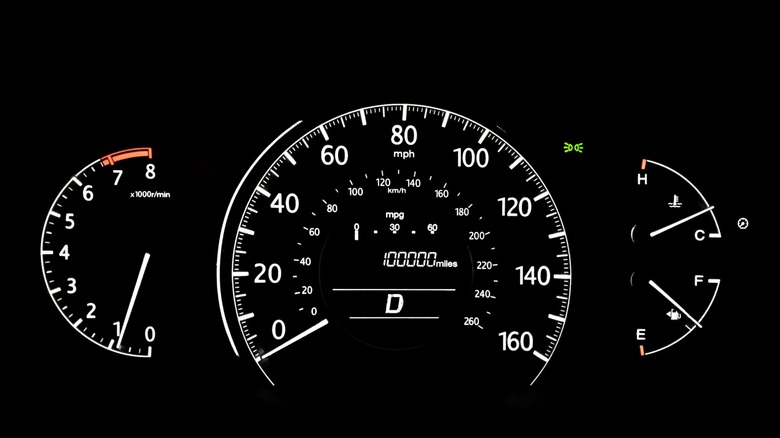 A car odometer showing 100,000 miles