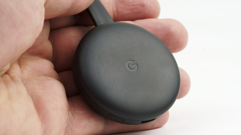 person holding Chromecast