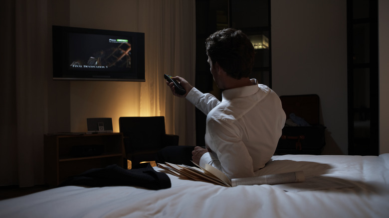 Person using TV with remote