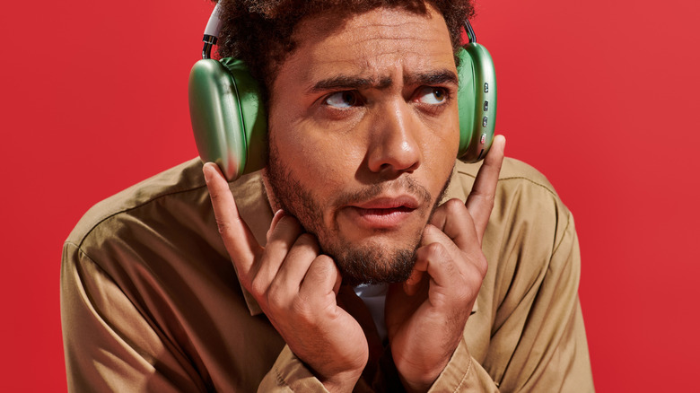 man listening to music confused