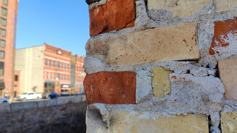 Bricks up close with buildings in distance