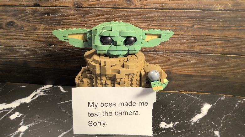 Lego Yoda holding a sign